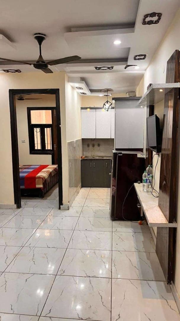 2 BHK fully furnished with car parking and ac, two double bed with mattress, TV, fridge, Gyser and modular kitchen.